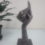 Mystico hand Face statue